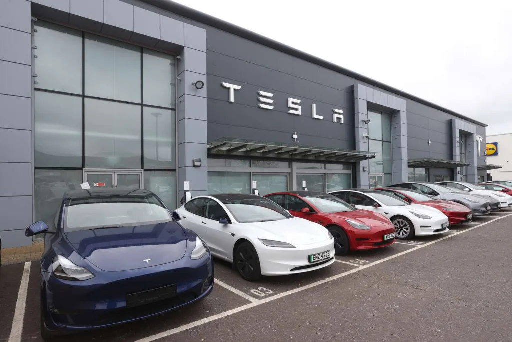 Tesla stock falls as 2025 delivery estimates are cut, raising concerns about future growth and market challenges.