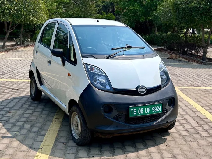 Tata Nano EV in a cityscape, showcasing its compact design and modern electric features.
